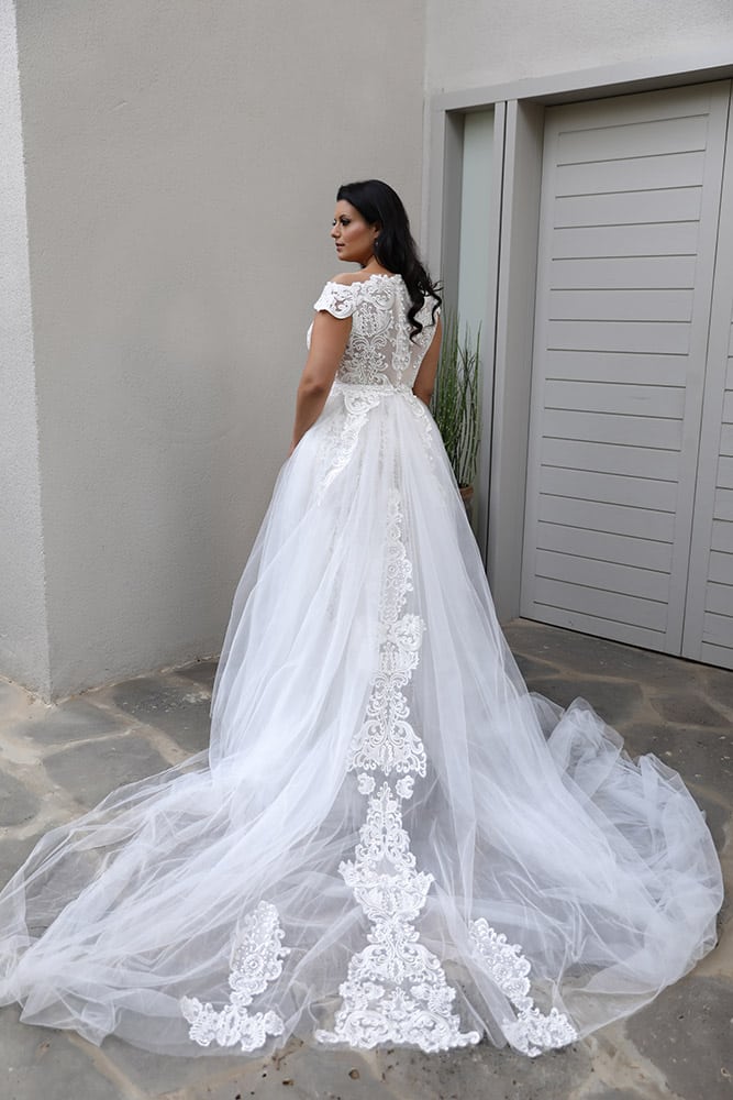 Adel by studio levana plus size fitted all lace bridel gown with an open nackline and a tulle over top skirt