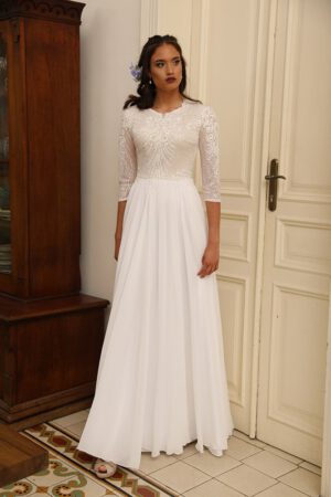 Adelaid by studio levana modest bridel gown with sparkls and sequined lace top and flowy skirt