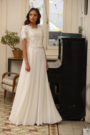 Aria by studio levana modest short sleeves wedding dress with baeded lace and flowy skirt