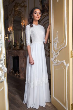 Rika by studio levana boho style modest wedding dress with lace long sleeves top and a lace and shiffon skirt