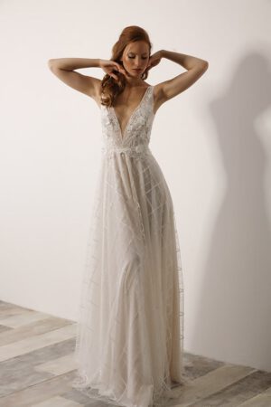 Tal by studio levana modern wedding dress with floral appliques and a sparkly tulle skirt