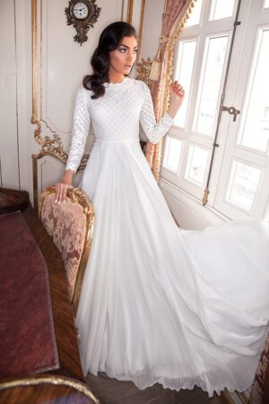 Tara by studio levana boho style modest wedding dress with lace and baeds top and a flowy skirt