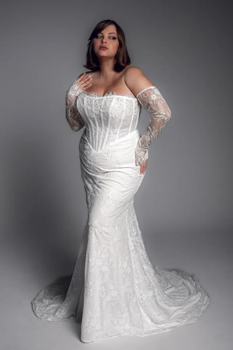 Studio Levana Lise plus size lace fitted wedding dress with lace fabric and an off-the-shoulder neckline, full-length front view